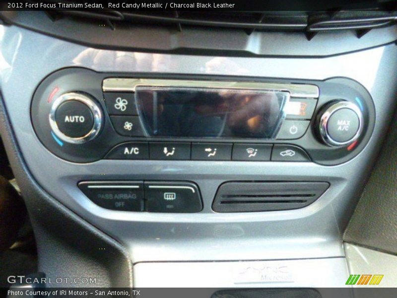 Red Candy Metallic / Charcoal Black Leather 2012 Ford Focus Titanium Sedan