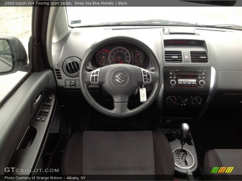 Deep Sea Blue Metallic / Black 2009 Suzuki SX4 Touring Sport Sedan