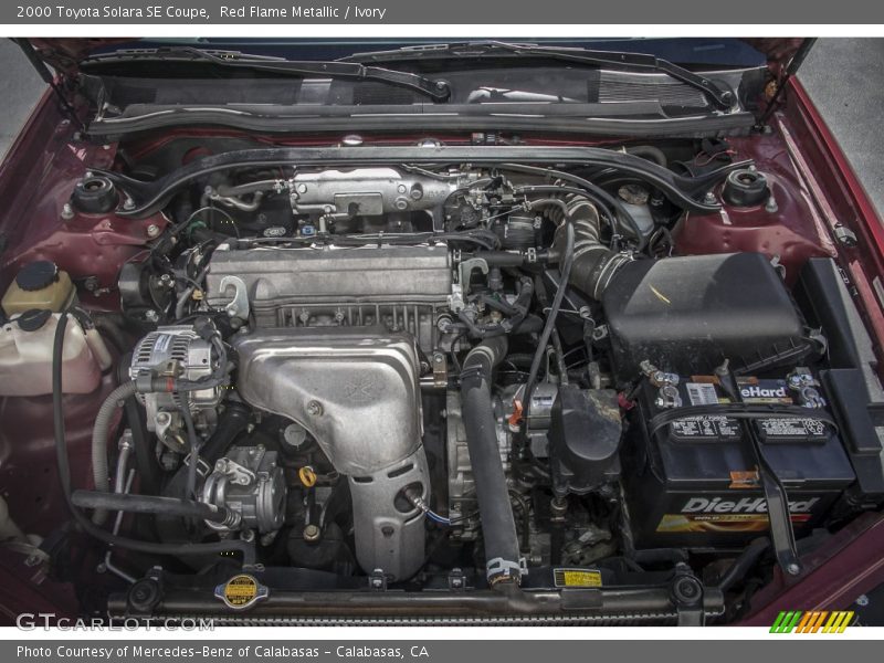 Red Flame Metallic / Ivory 2000 Toyota Solara SE Coupe