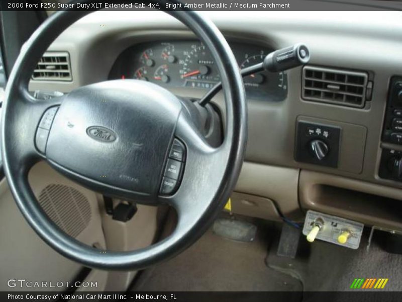 Bright Amber Metallic / Medium Parchment 2000 Ford F250 Super Duty XLT Extended Cab 4x4