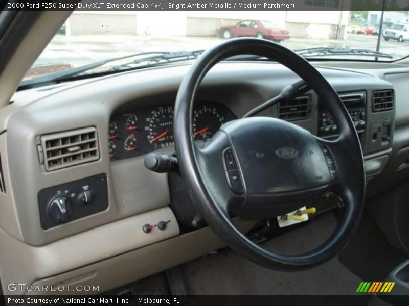 Bright Amber Metallic / Medium Parchment 2000 Ford F250 Super Duty XLT Extended Cab 4x4