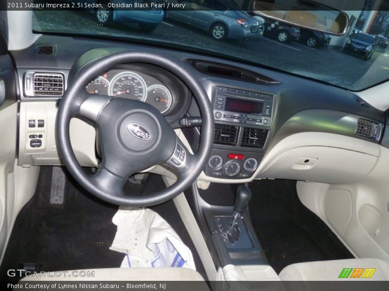 Obsidian Black Pearl / Ivory 2011 Subaru Impreza 2.5i Sedan