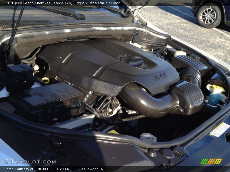 Bright Silver Metallic / Black 2011 Jeep Grand Cherokee Laredo 4x4