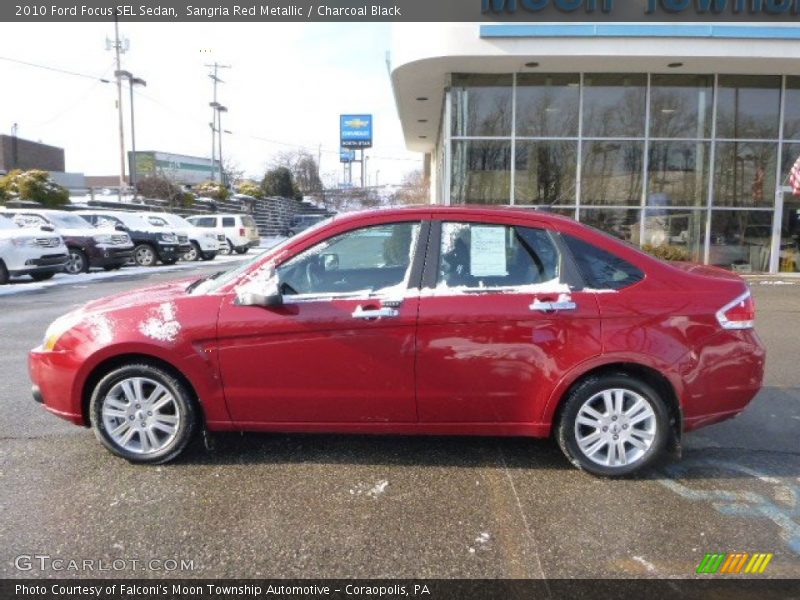 Sangria Red Metallic / Charcoal Black 2010 Ford Focus SEL Sedan