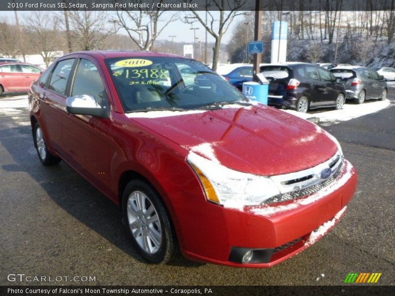 Sangria Red Metallic / Charcoal Black 2010 Ford Focus SEL Sedan