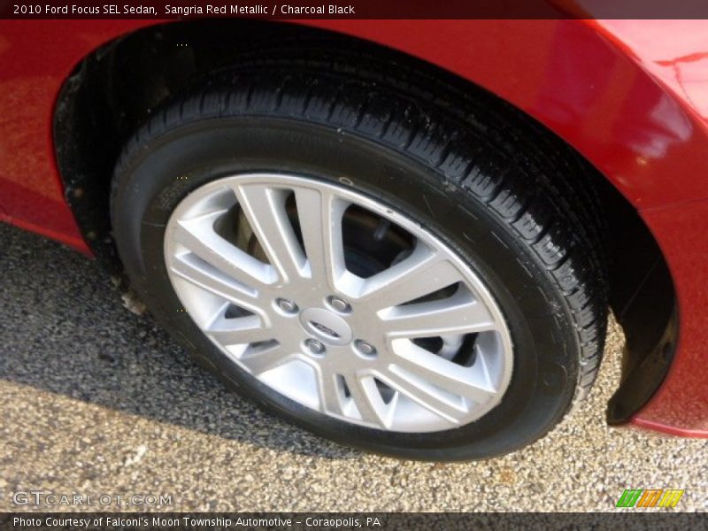 Sangria Red Metallic / Charcoal Black 2010 Ford Focus SEL Sedan