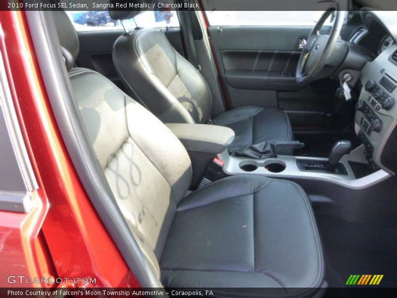 Sangria Red Metallic / Charcoal Black 2010 Ford Focus SEL Sedan