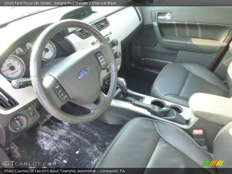 Sangria Red Metallic / Charcoal Black 2010 Ford Focus SEL Sedan