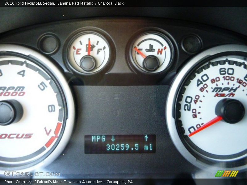 Sangria Red Metallic / Charcoal Black 2010 Ford Focus SEL Sedan