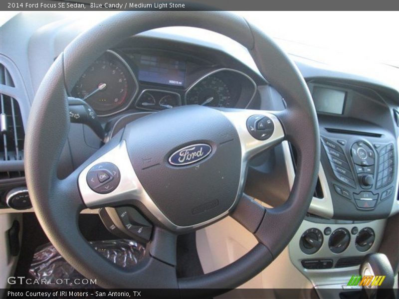 Blue Candy / Medium Light Stone 2014 Ford Focus SE Sedan