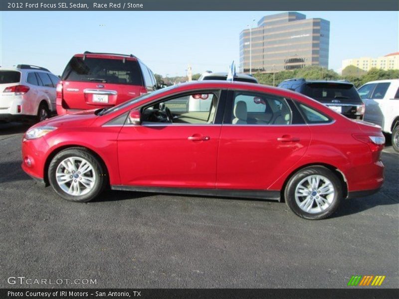 Race Red / Stone 2012 Ford Focus SEL Sedan