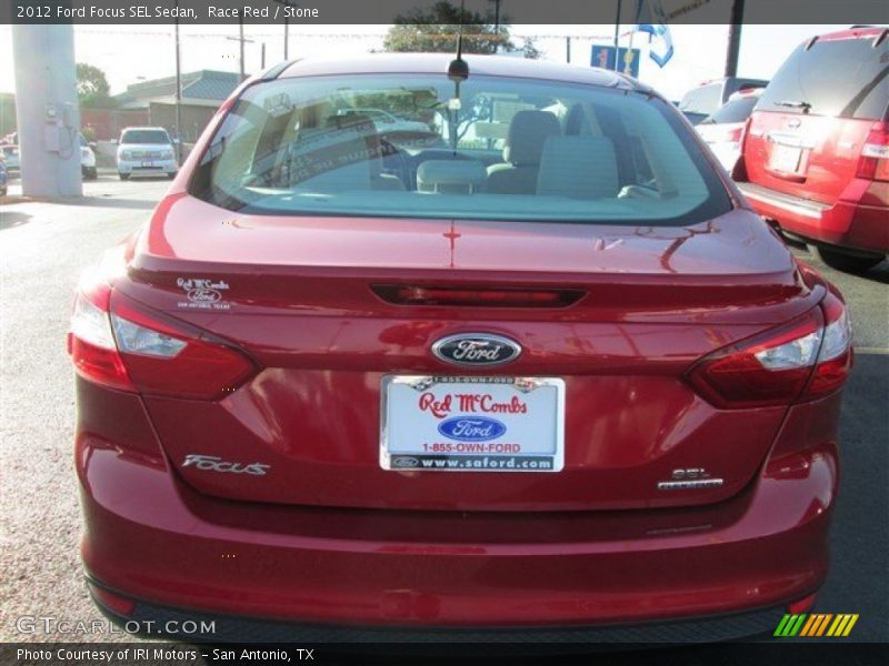 Race Red / Stone 2012 Ford Focus SEL Sedan