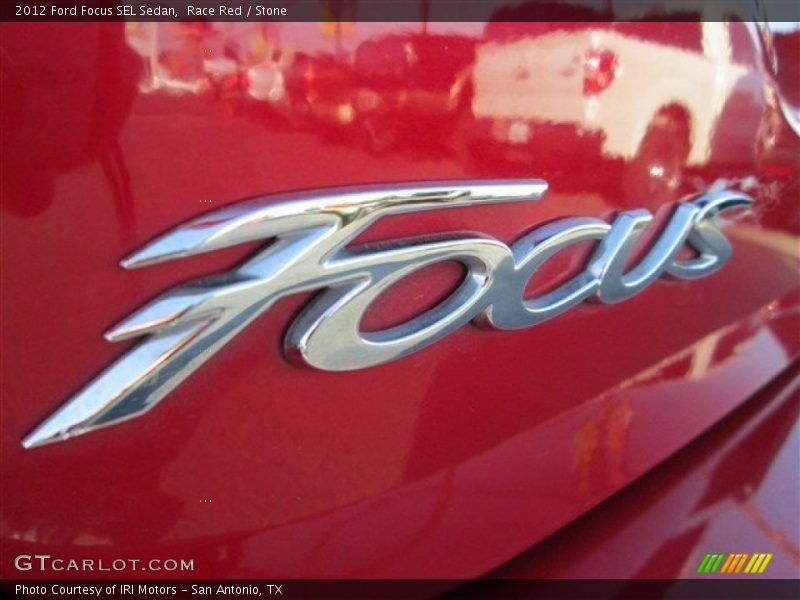 Race Red / Stone 2012 Ford Focus SEL Sedan