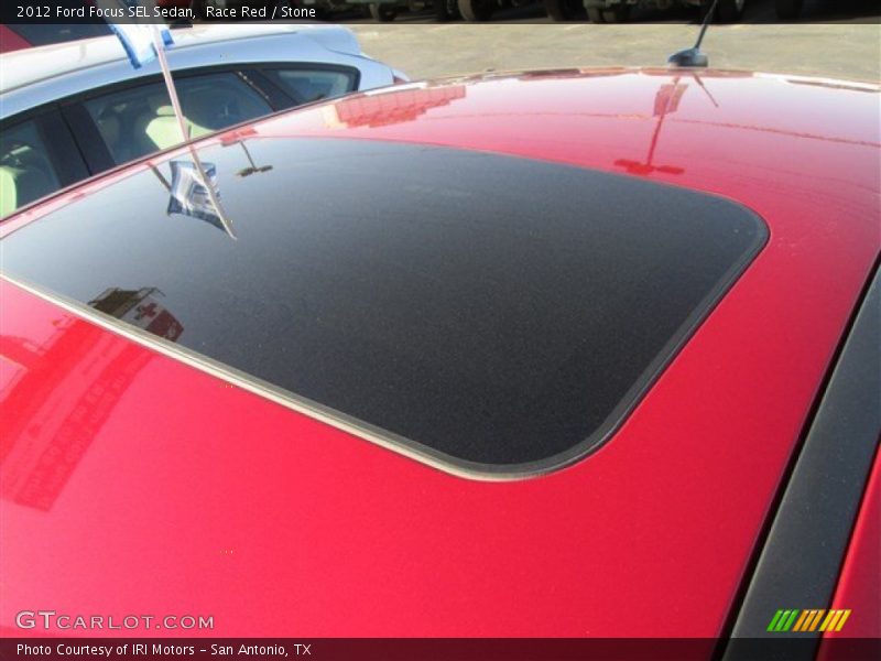 Race Red / Stone 2012 Ford Focus SEL Sedan