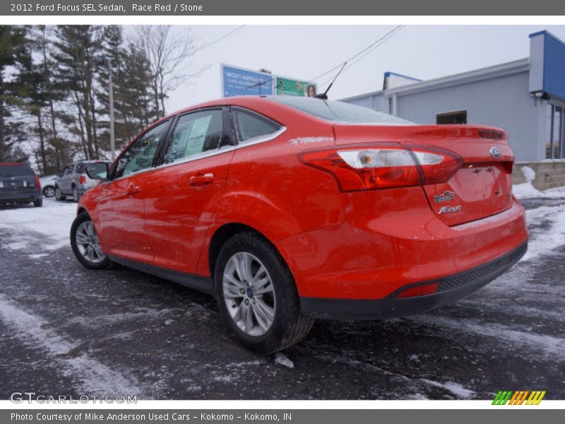 Race Red / Stone 2012 Ford Focus SEL Sedan