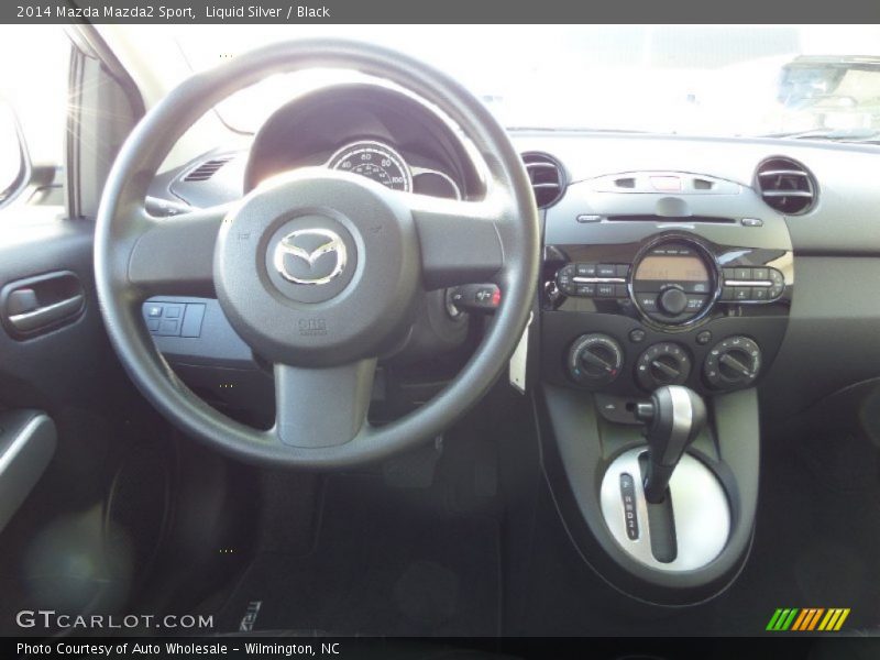 Dashboard of 2014 Mazda2 Sport