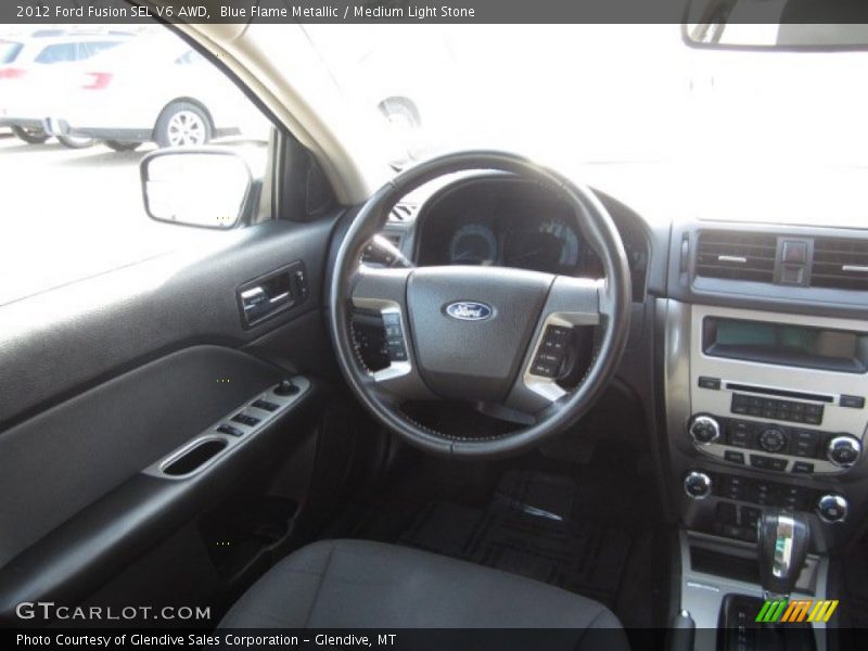 Blue Flame Metallic / Medium Light Stone 2012 Ford Fusion SEL V6 AWD