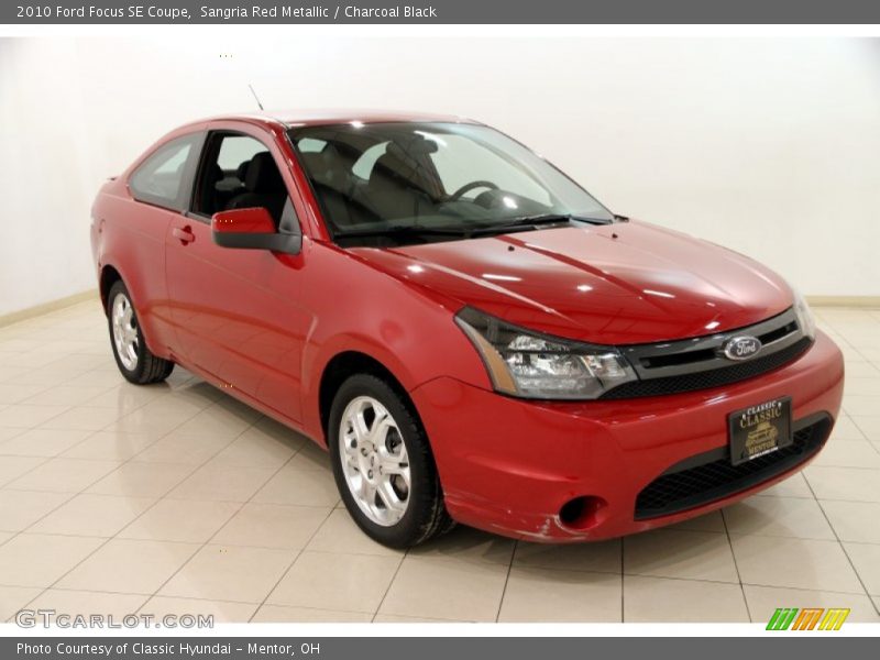 Sangria Red Metallic / Charcoal Black 2010 Ford Focus SE Coupe