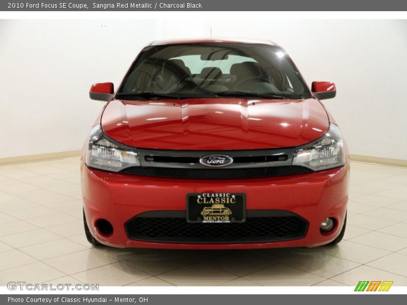 Sangria Red Metallic / Charcoal Black 2010 Ford Focus SE Coupe