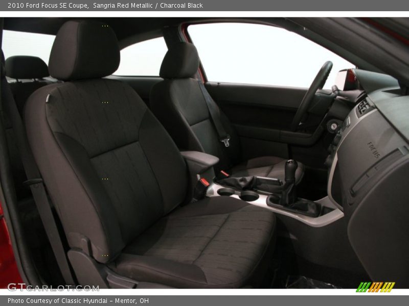 Sangria Red Metallic / Charcoal Black 2010 Ford Focus SE Coupe