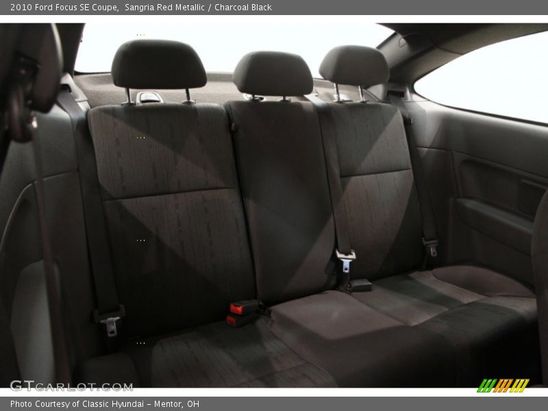 Sangria Red Metallic / Charcoal Black 2010 Ford Focus SE Coupe