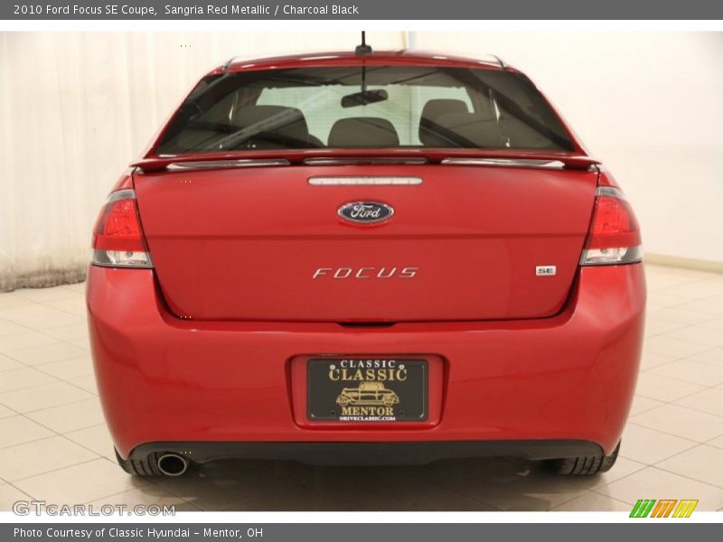 Sangria Red Metallic / Charcoal Black 2010 Ford Focus SE Coupe