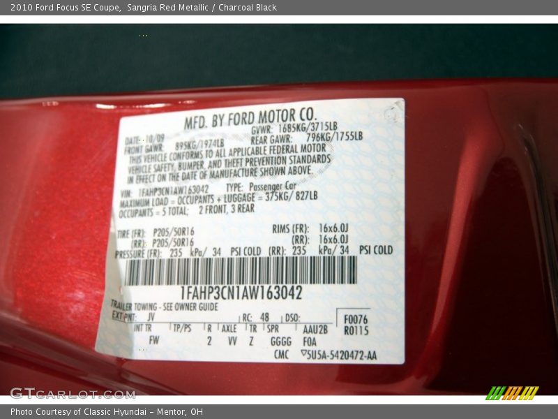 Sangria Red Metallic / Charcoal Black 2010 Ford Focus SE Coupe