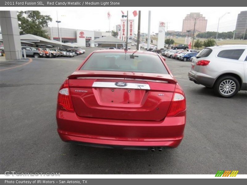 Red Candy Metallic / Medium Light Stone 2011 Ford Fusion SEL