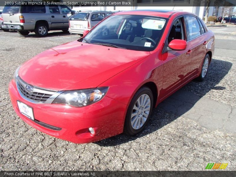 Lightning Red / Carbon Black 2009 Subaru Impreza 2.5i Premium Sedan