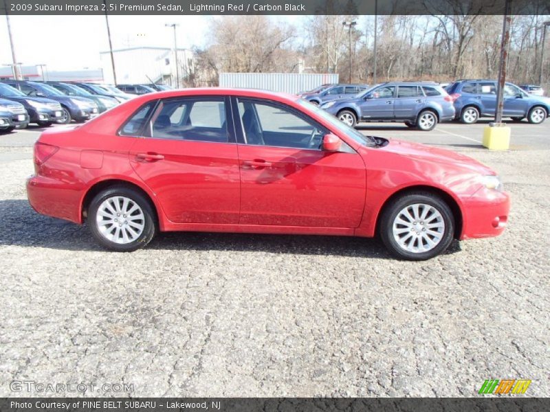 Lightning Red / Carbon Black 2009 Subaru Impreza 2.5i Premium Sedan