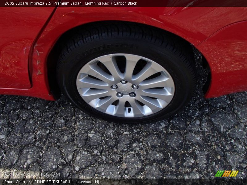 Lightning Red / Carbon Black 2009 Subaru Impreza 2.5i Premium Sedan