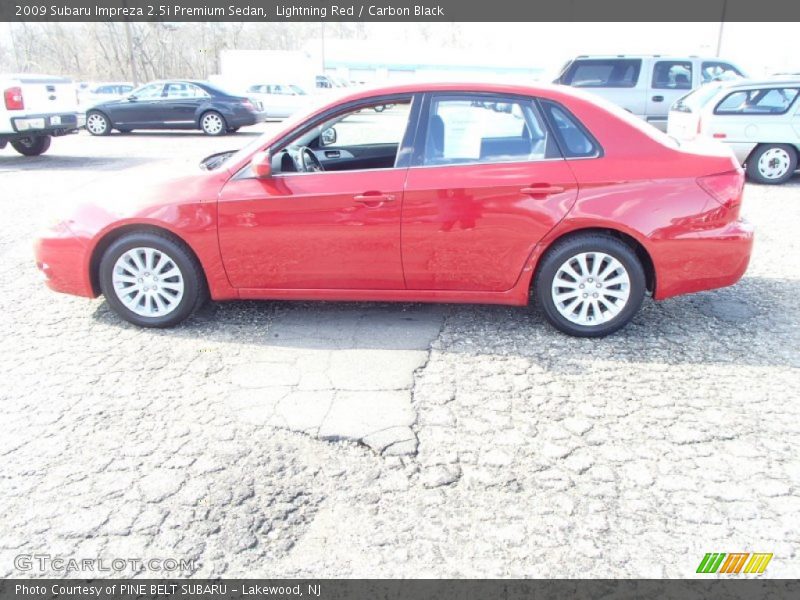 Lightning Red / Carbon Black 2009 Subaru Impreza 2.5i Premium Sedan
