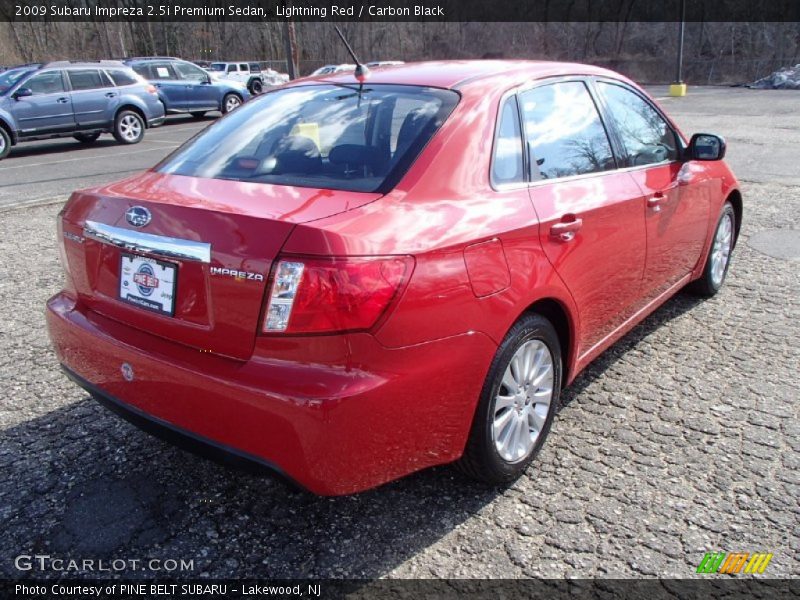 Lightning Red / Carbon Black 2009 Subaru Impreza 2.5i Premium Sedan
