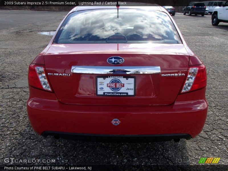 Lightning Red / Carbon Black 2009 Subaru Impreza 2.5i Premium Sedan