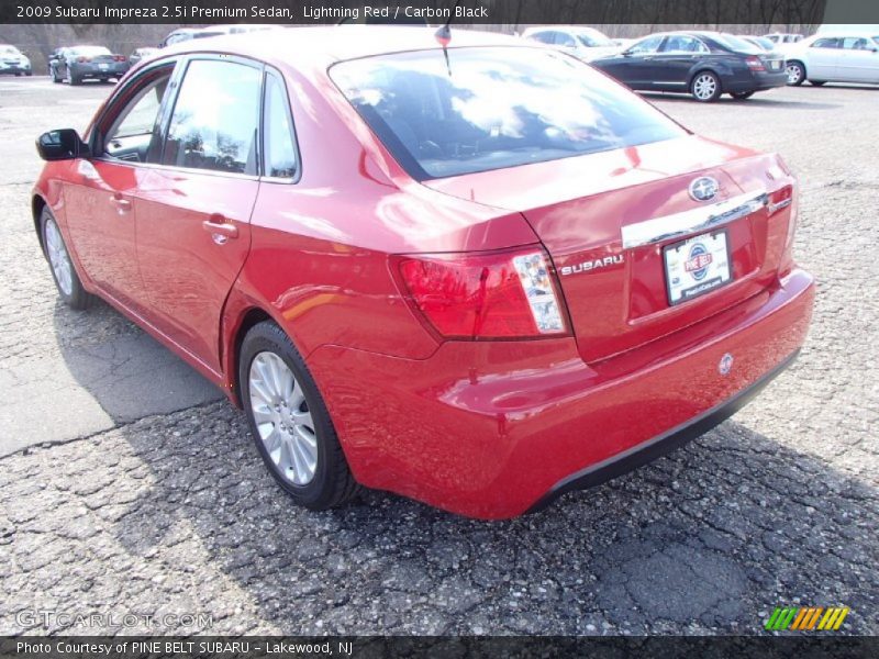 Lightning Red / Carbon Black 2009 Subaru Impreza 2.5i Premium Sedan