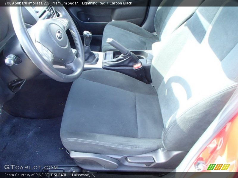 Lightning Red / Carbon Black 2009 Subaru Impreza 2.5i Premium Sedan
