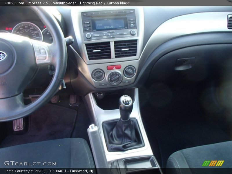 Lightning Red / Carbon Black 2009 Subaru Impreza 2.5i Premium Sedan
