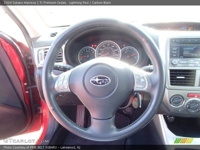 Lightning Red / Carbon Black 2009 Subaru Impreza 2.5i Premium Sedan