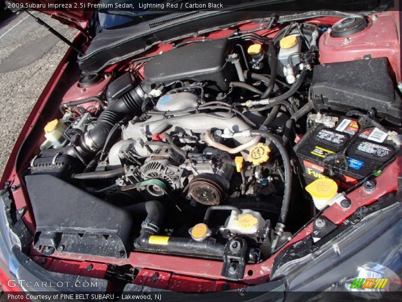 Lightning Red / Carbon Black 2009 Subaru Impreza 2.5i Premium Sedan