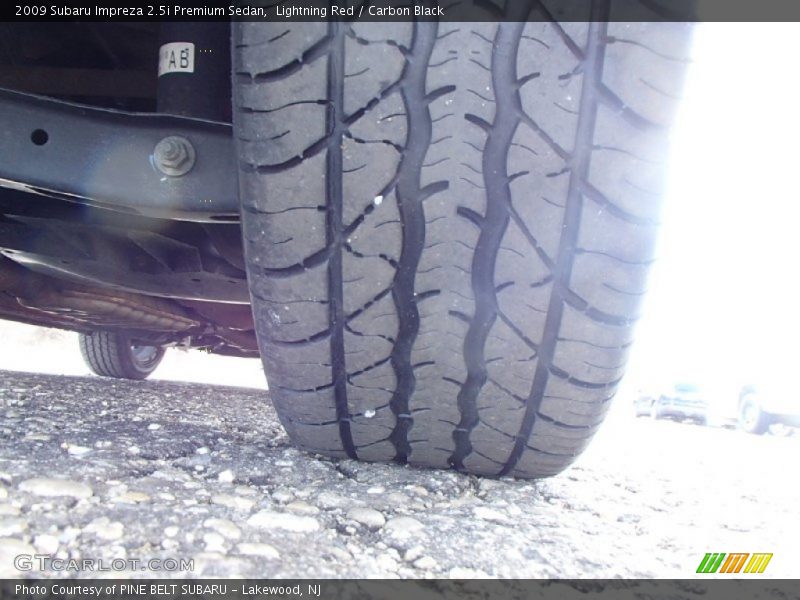 Lightning Red / Carbon Black 2009 Subaru Impreza 2.5i Premium Sedan