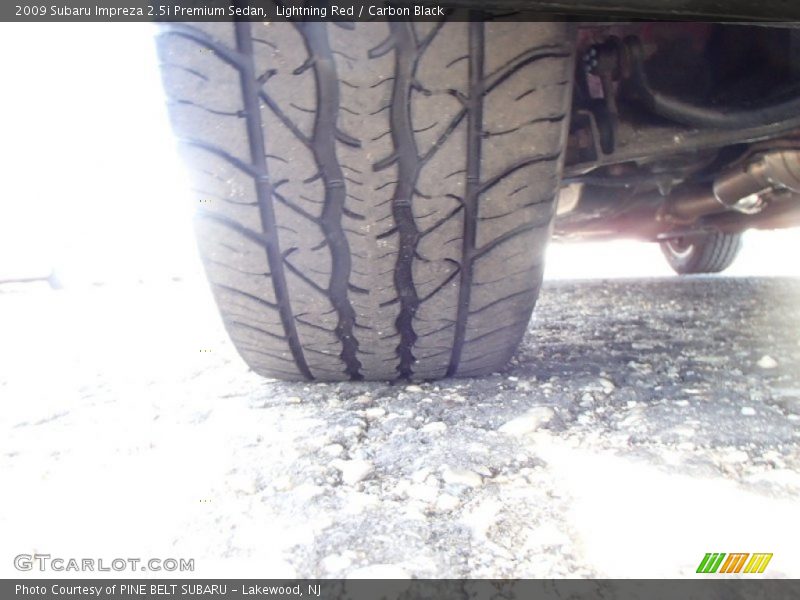Lightning Red / Carbon Black 2009 Subaru Impreza 2.5i Premium Sedan