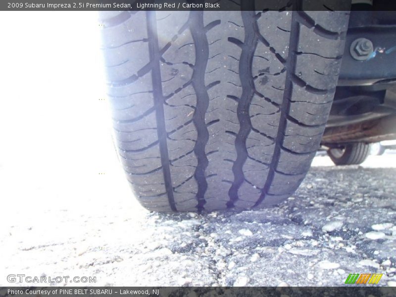 Lightning Red / Carbon Black 2009 Subaru Impreza 2.5i Premium Sedan