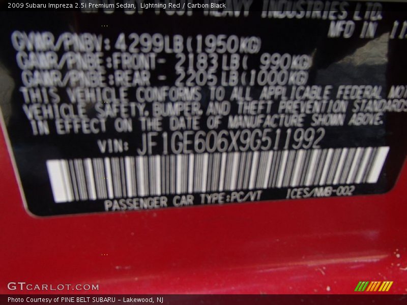 Lightning Red / Carbon Black 2009 Subaru Impreza 2.5i Premium Sedan