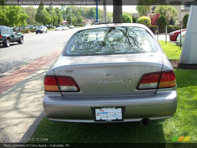 Sunlit Sand Metallic / Charcoal Black 1999 Nissan Maxima GLE