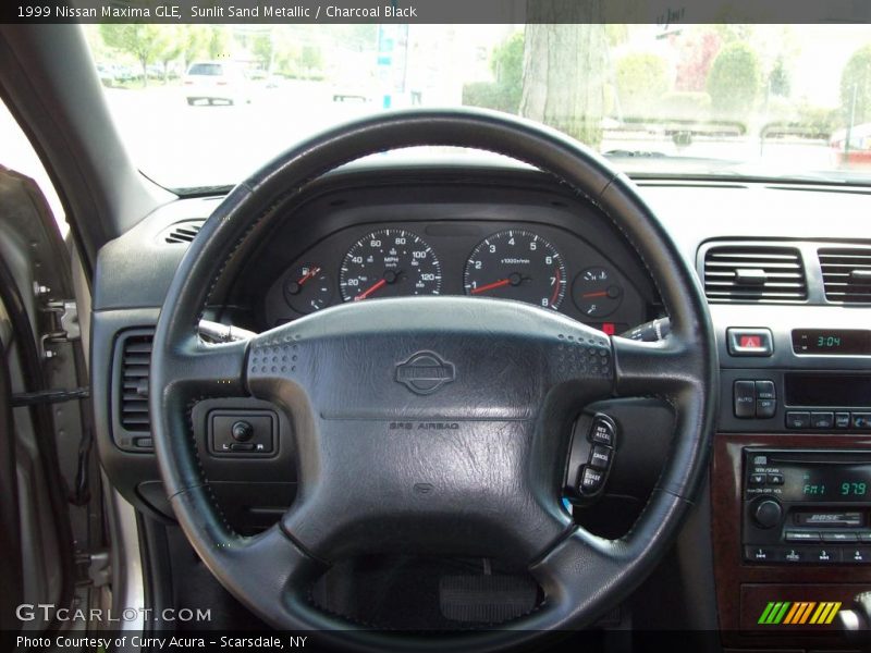Sunlit Sand Metallic / Charcoal Black 1999 Nissan Maxima GLE