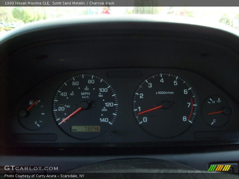 Sunlit Sand Metallic / Charcoal Black 1999 Nissan Maxima GLE