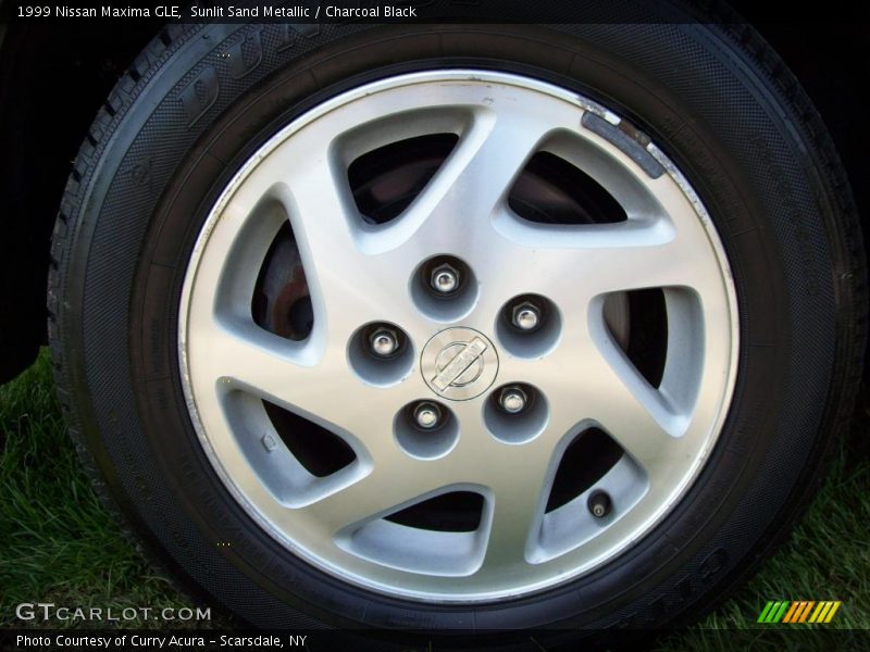 Sunlit Sand Metallic / Charcoal Black 1999 Nissan Maxima GLE