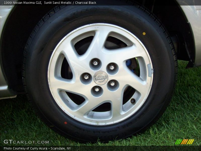 Sunlit Sand Metallic / Charcoal Black 1999 Nissan Maxima GLE