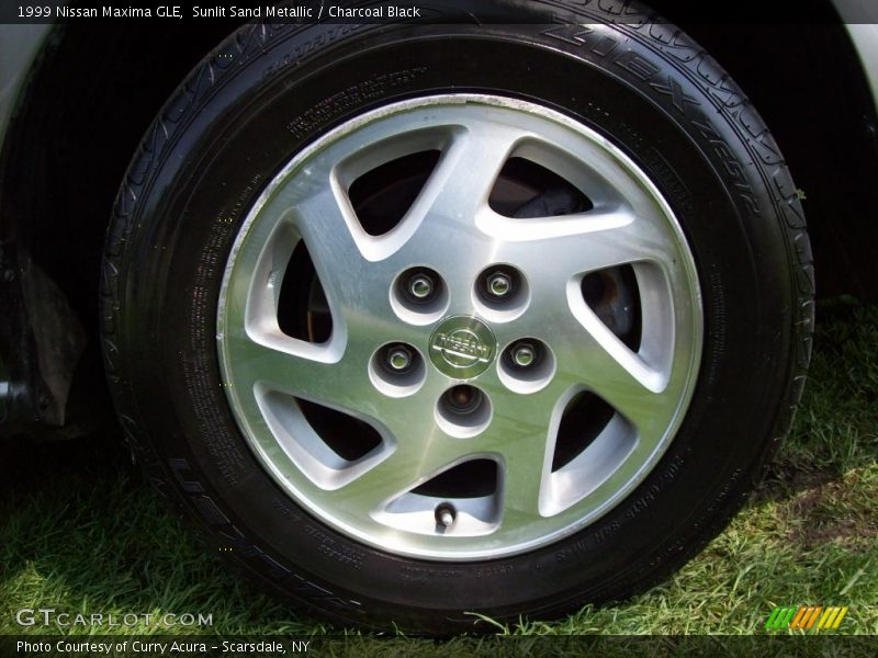 Sunlit Sand Metallic / Charcoal Black 1999 Nissan Maxima GLE
