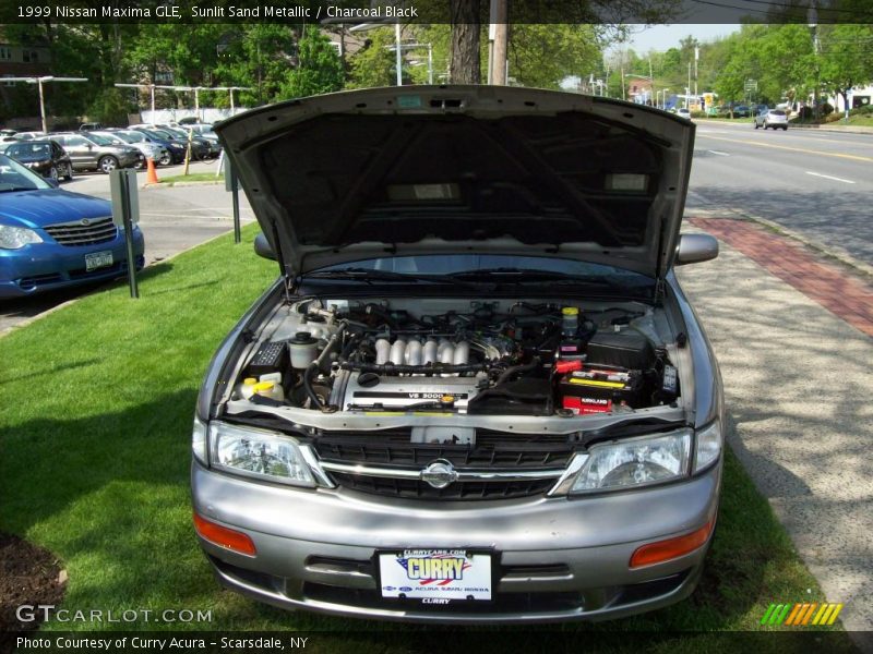 Sunlit Sand Metallic / Charcoal Black 1999 Nissan Maxima GLE